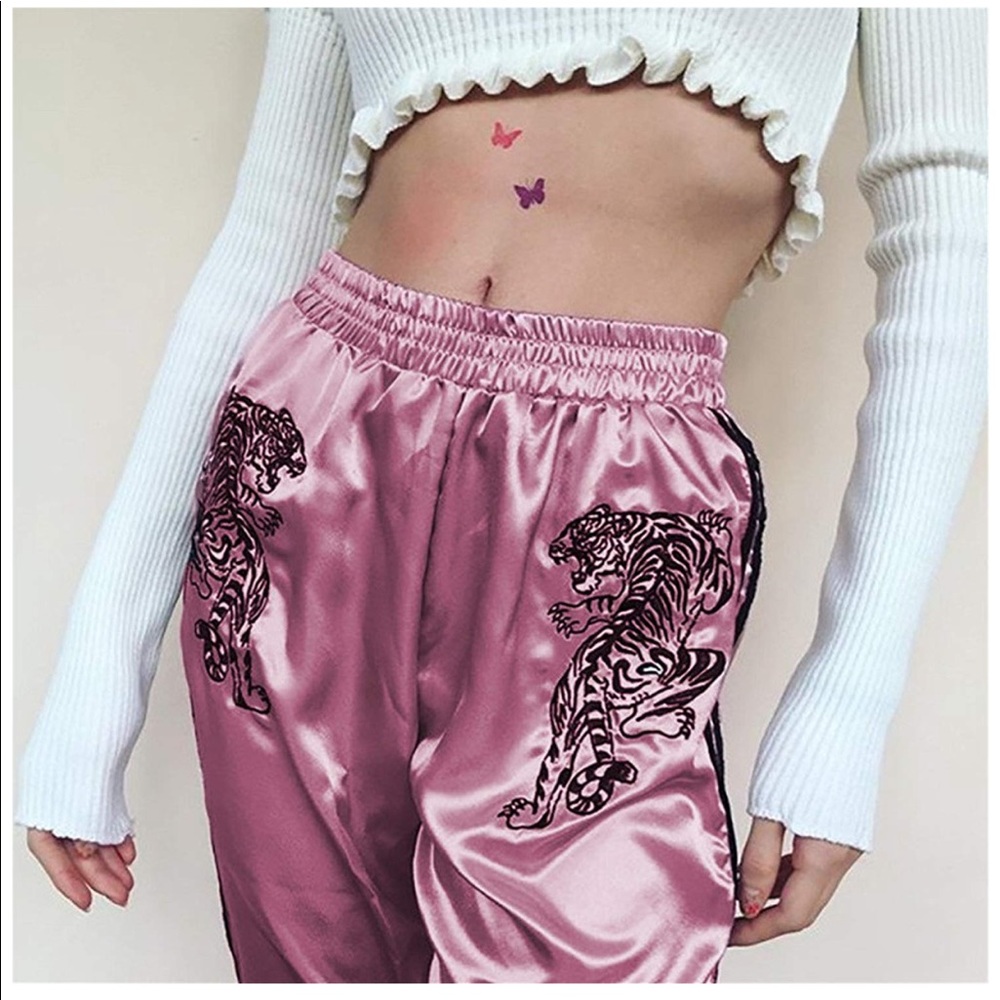 Pink joggers with tiger embroidered